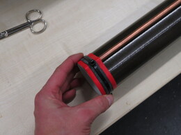 attaching the copper rod to the lower end of GRP tube